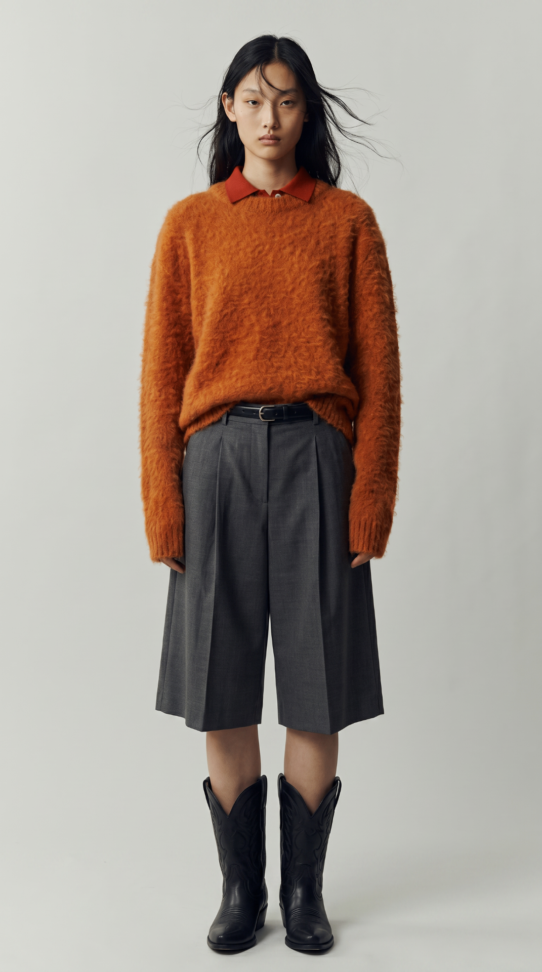 Look 05 — brushed rust sweater over a collared top with tailored charcoal culottes and western boots.