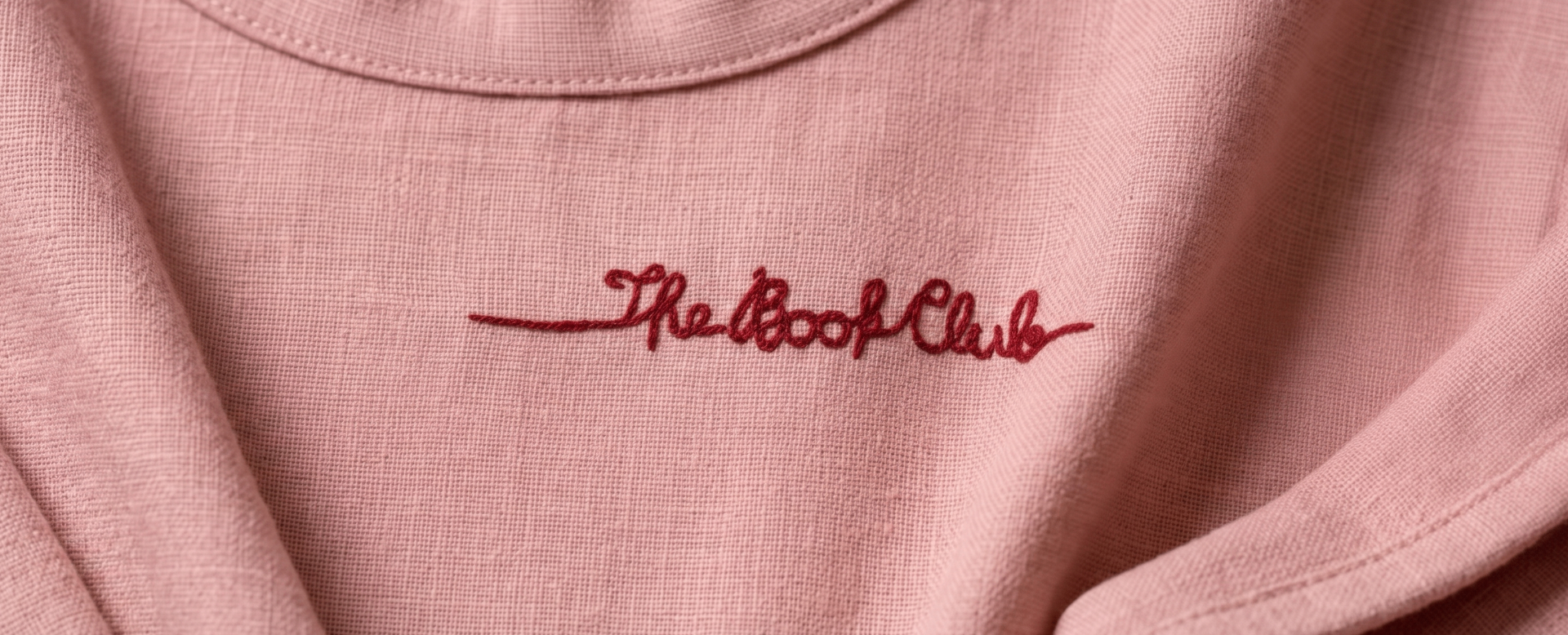 The Book Club embroidered signature on pink linen